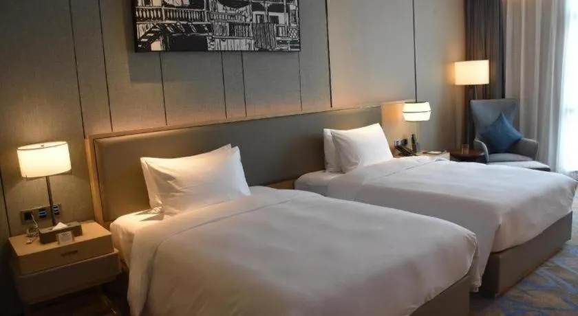 Bed in Zhuhai Tangyi Hotel