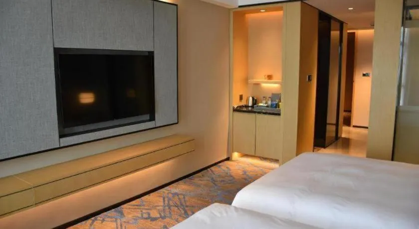 Bed in Zhuhai Tangyi Hotel