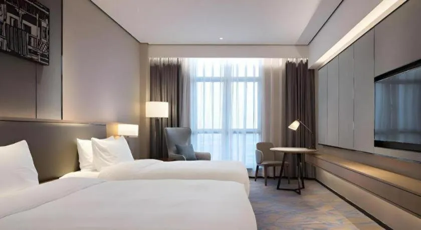 Bed in Zhuhai Tangyi Hotel