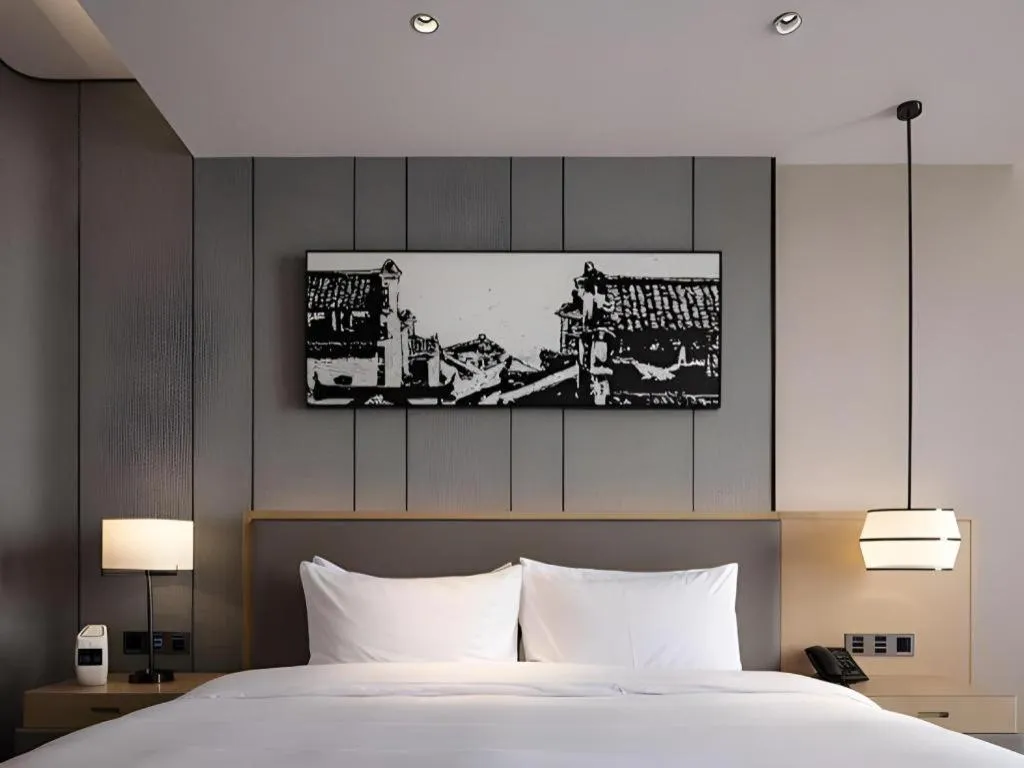 Bed in Zhuhai Tangyi Hotel