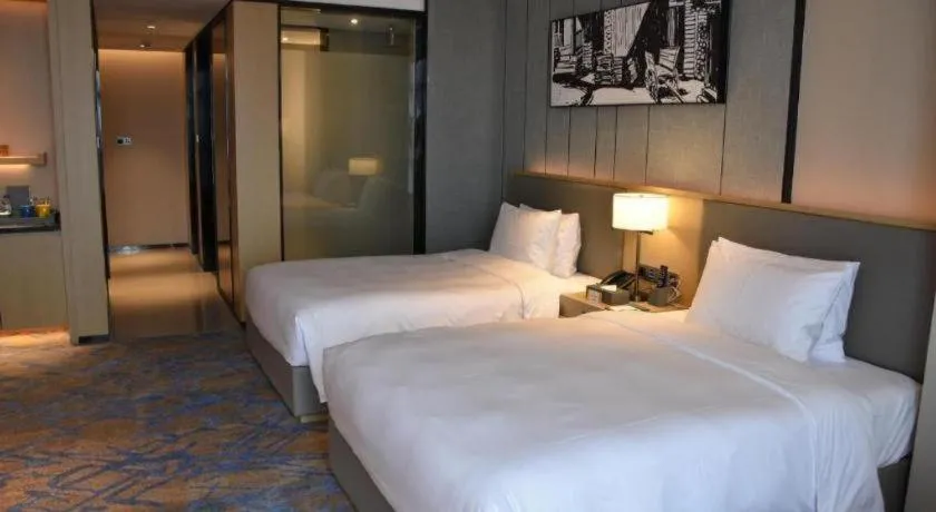 Bed in Zhuhai Tangyi Hotel