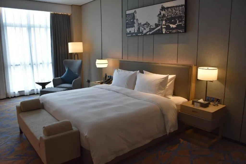 Bed in Zhuhai Tangyi Hotel