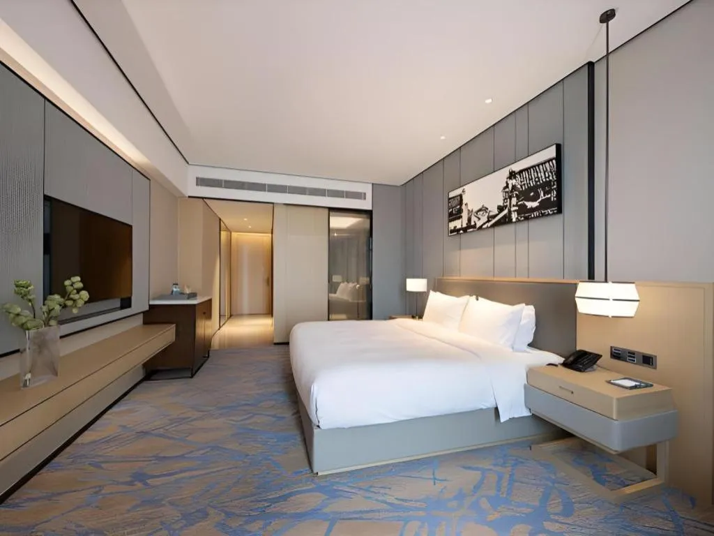 Bed in Zhuhai Tangyi Hotel