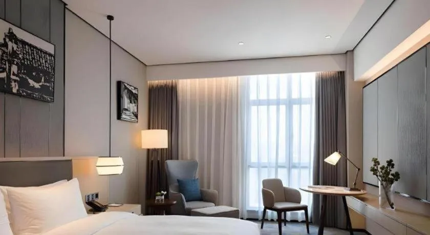 Bed in Zhuhai Tangyi Hotel