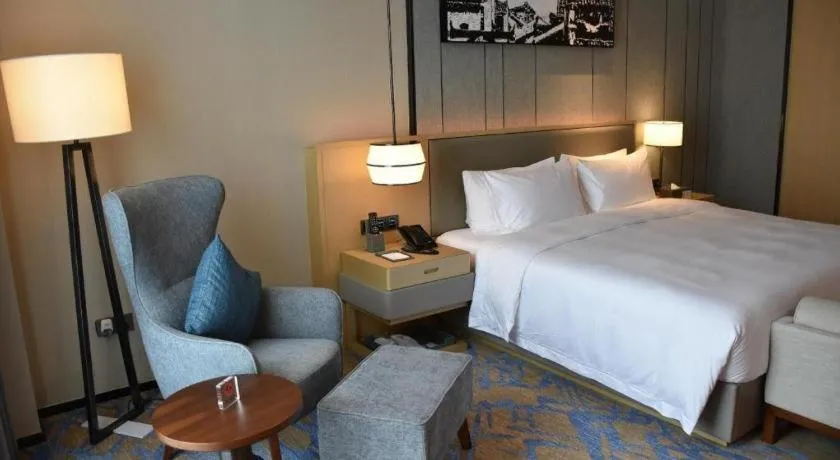 Bed in Zhuhai Tangyi Hotel