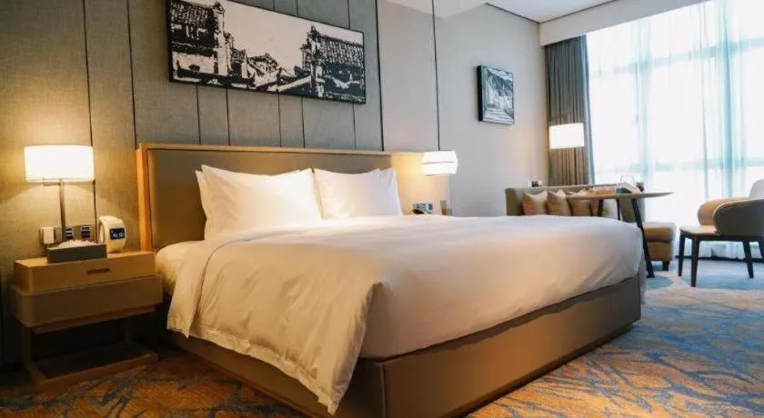 Bed in Zhuhai Tangyi Hotel