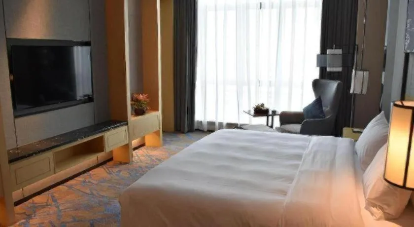 Bed in Zhuhai Tangyi Hotel
