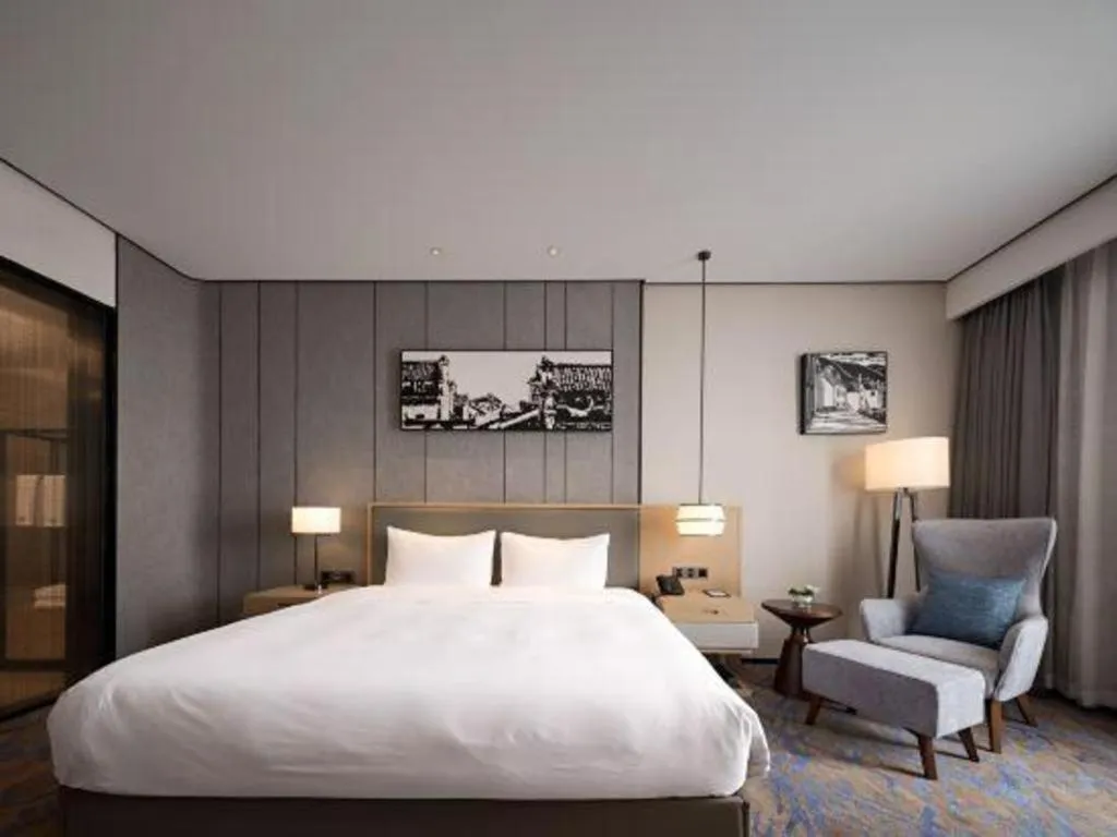 Bed in Zhuhai Tangyi Hotel