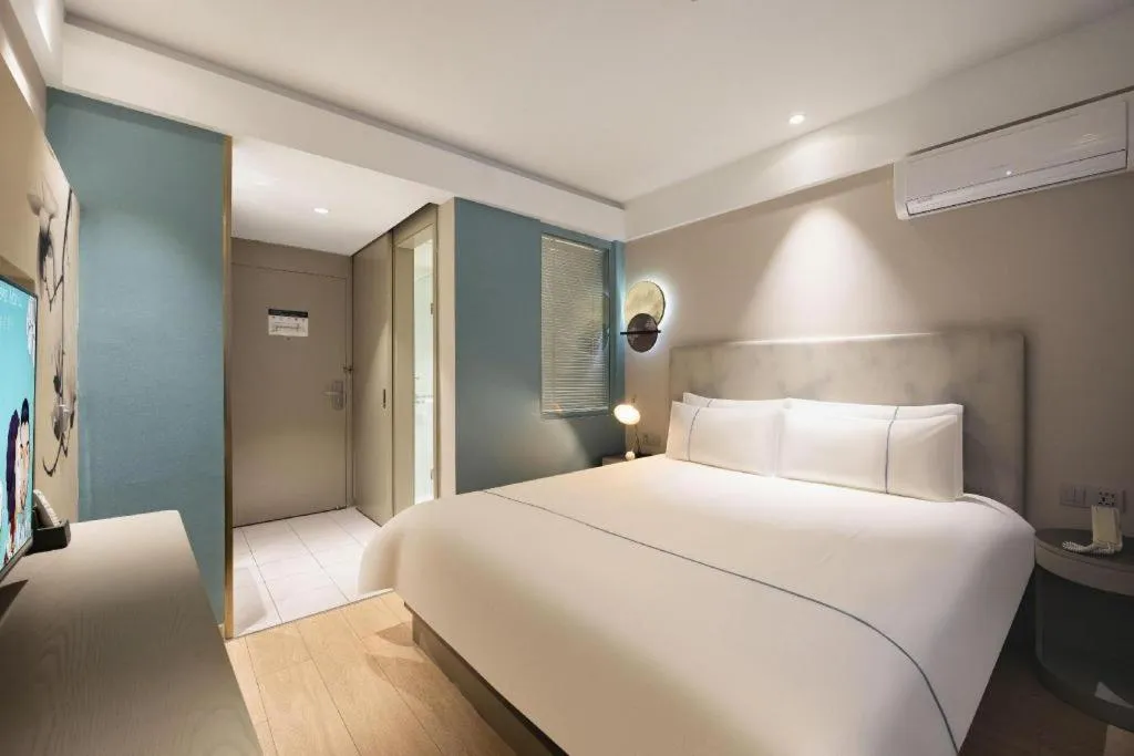 Bed in Magnotel Harbin Medical University First Affiliated Hospital