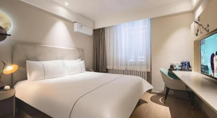 Bed in Magnotel Harbin Medical University First Affiliated Hospital