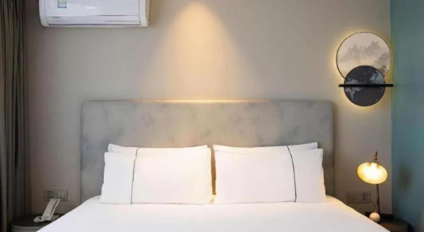 Bed in Magnotel Harbin Medical University First Affiliated Hospital