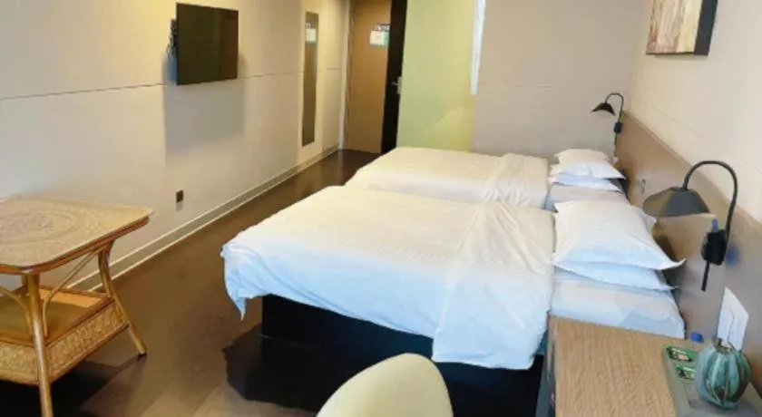 Bed in Jinjiang Inn Select Yancheng Oufeng Hua Street Julong Lake