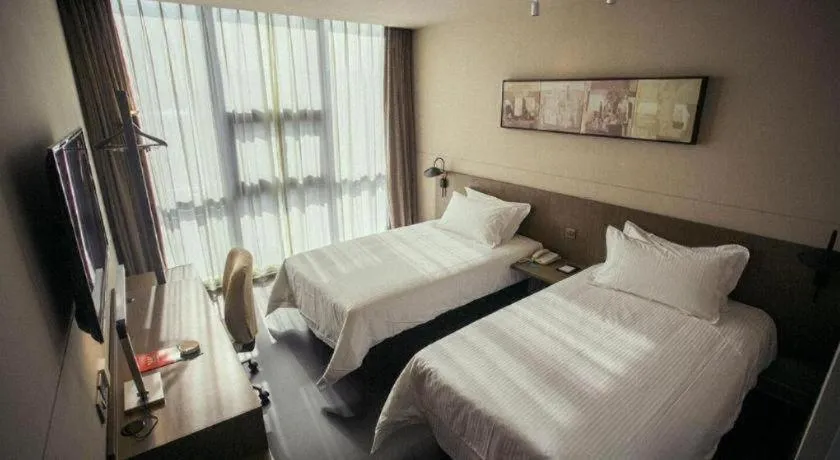 Bed in Jinjiang Inn Select Yancheng Oufeng Hua Street Julong Lake