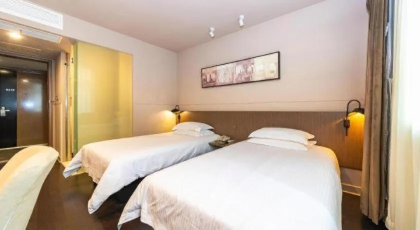 Bed in Jinjiang Inn Select Yancheng Oufeng Hua Street Julong Lake