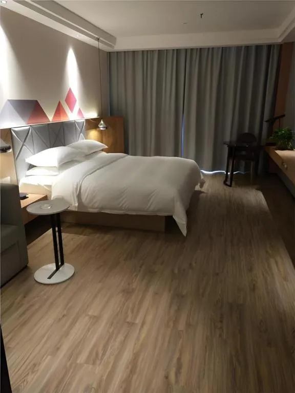 Bed in Borrman Hotel Hechi Bama Central Cultural Plaza