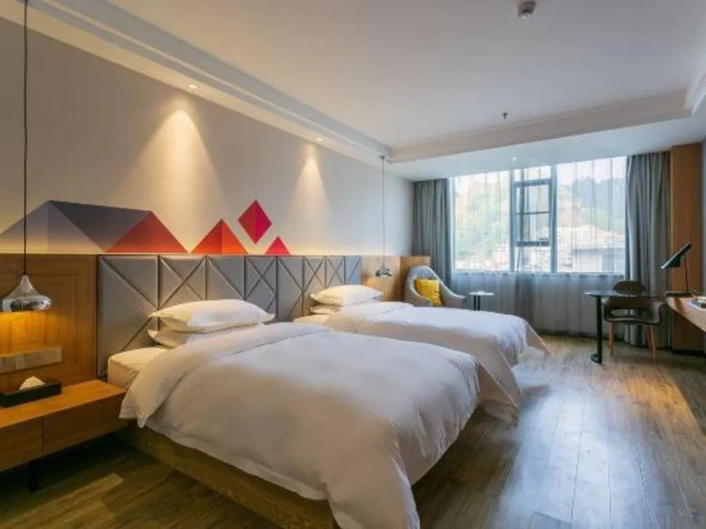 Bed in Borrman Hotel Hechi Bama Central Cultural Plaza