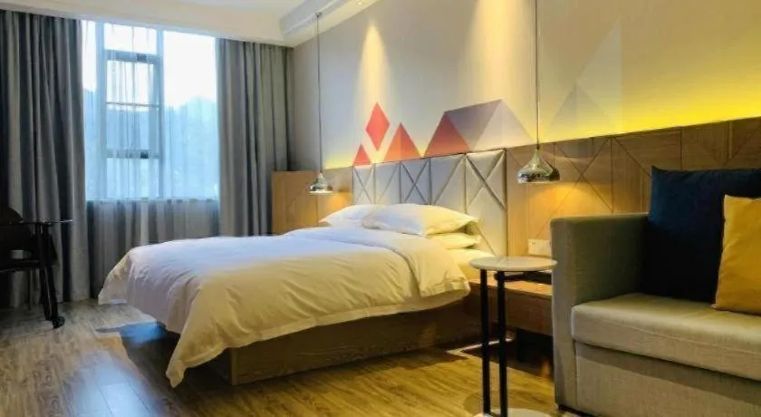 Bed in Borrman Hotel Hechi Bama Central Cultural Plaza