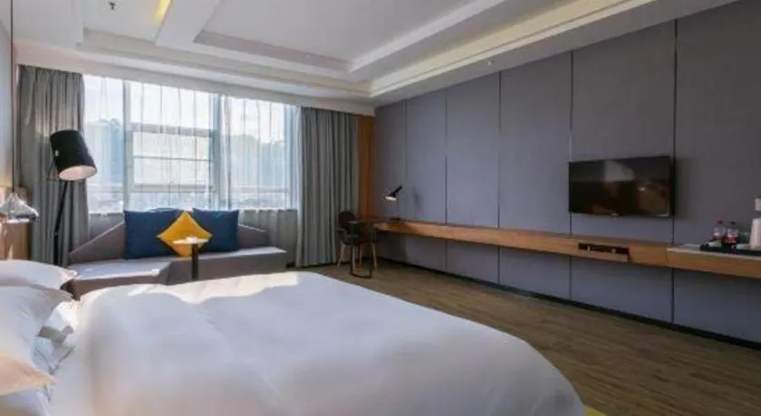 Bed in Borrman Hotel Hechi Bama Central Cultural Plaza