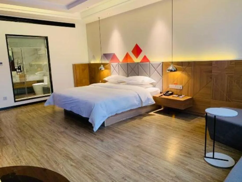 Bed in Borrman Hotel Hechi Bama Central Cultural Plaza