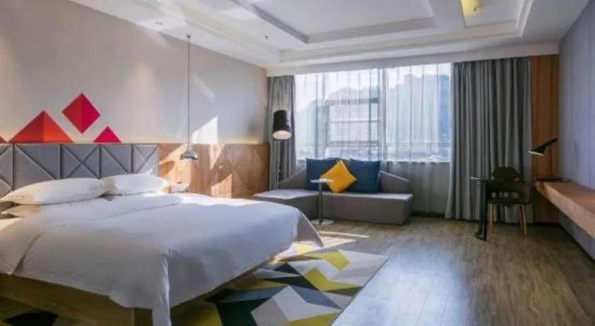 Bed in Borrman Hotel Hechi Bama Central Cultural Plaza