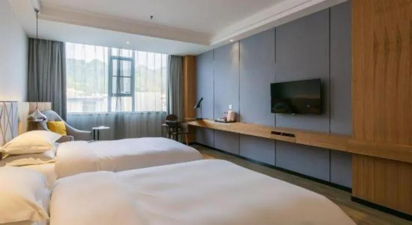 Bed in Borrman Hotel Hechi Bama Central Cultural Plaza