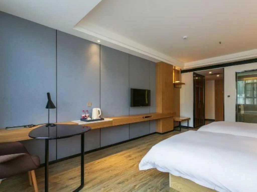 Bed in Borrman Hotel Hechi Bama Central Cultural Plaza