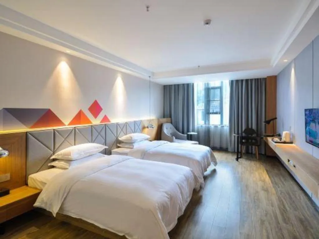 Bed in Borrman Hotel Hechi Bama Central Cultural Plaza