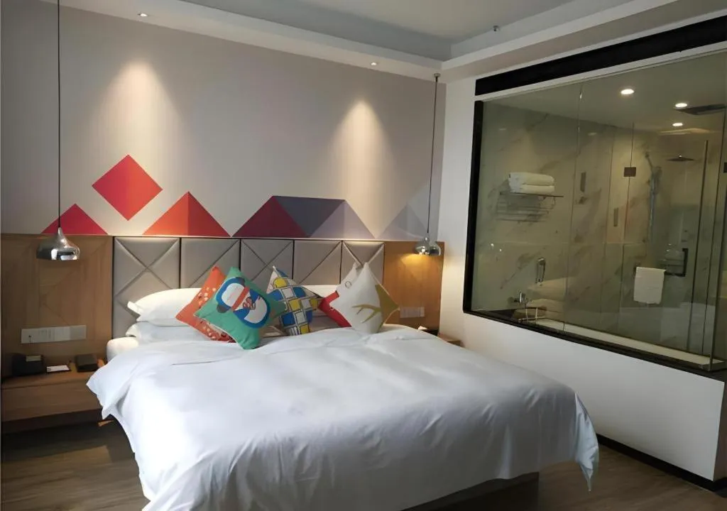 Bed in Borrman Hotel Hechi Bama Central Cultural Plaza