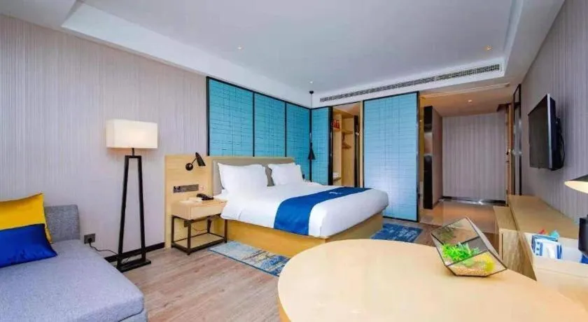 Bed in Echarm Hotel Xiantao Yuantai Weilaicheng