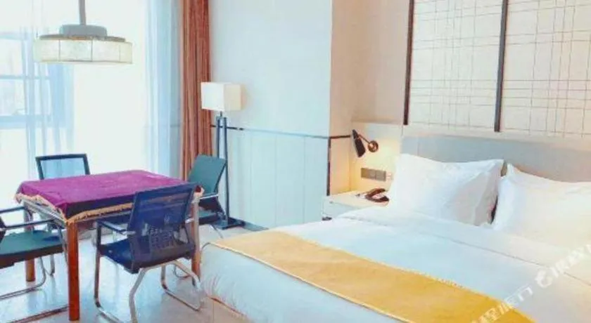 Bed in Echarm Hotel Xiantao Yuantai Weilaicheng