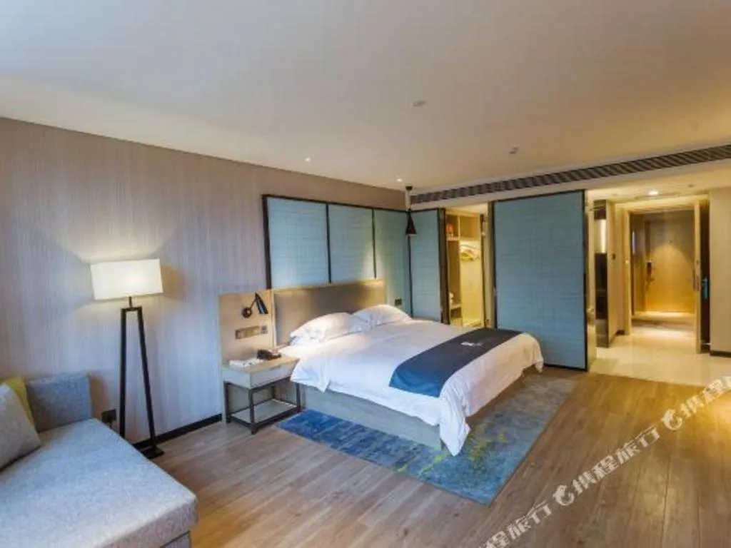 Bed in Echarm Hotel Xiantao Yuantai Weilaicheng