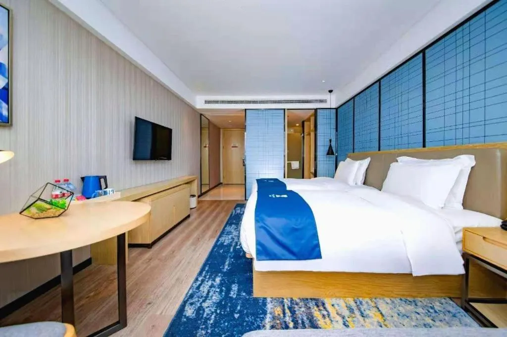 Bed in Echarm Hotel Xiantao Yuantai Weilaicheng