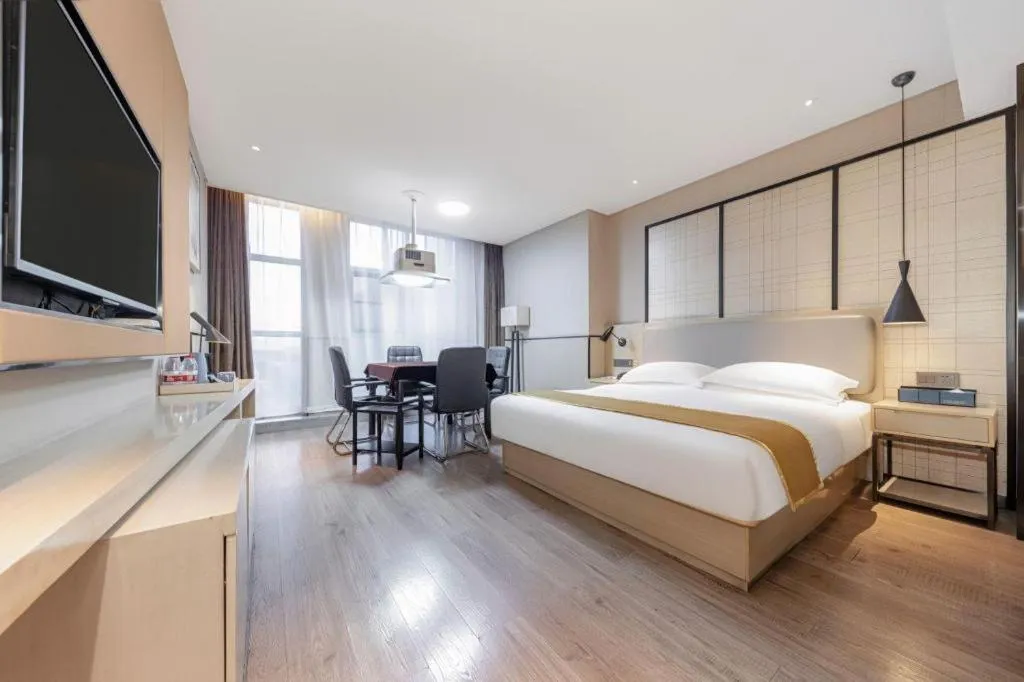 Bed in Echarm Hotel Xiantao Yuantai Weilaicheng