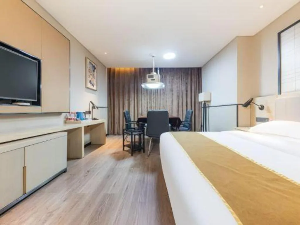 Bed in Echarm Hotel Xiantao Yuantai Weilaicheng