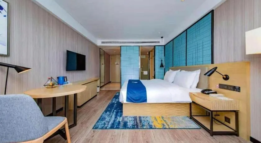 Bed in Echarm Hotel Xiantao Yuantai Weilaicheng