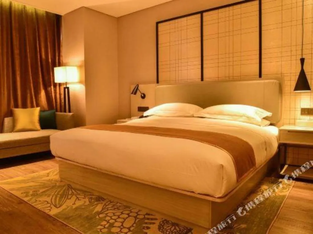 Bed in Echarm Hotel Xiantao Yuantai Weilaicheng