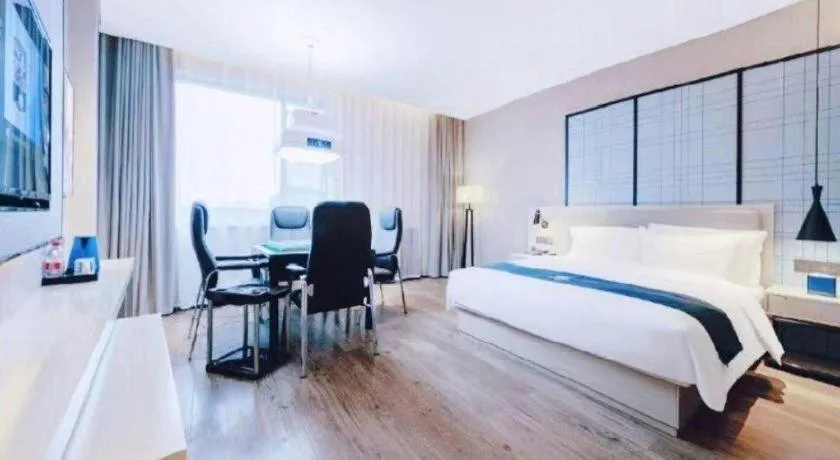 Bed in Echarm Hotel Xiantao Yuantai Weilaicheng