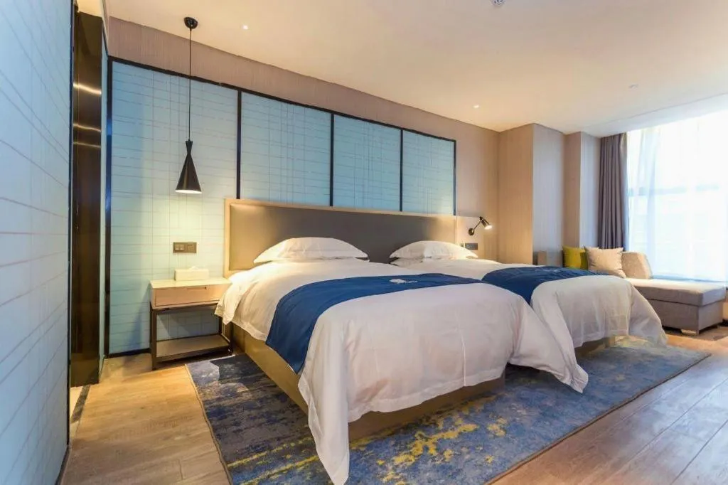 Bed in Echarm Hotel Xiantao Yuantai Weilaicheng