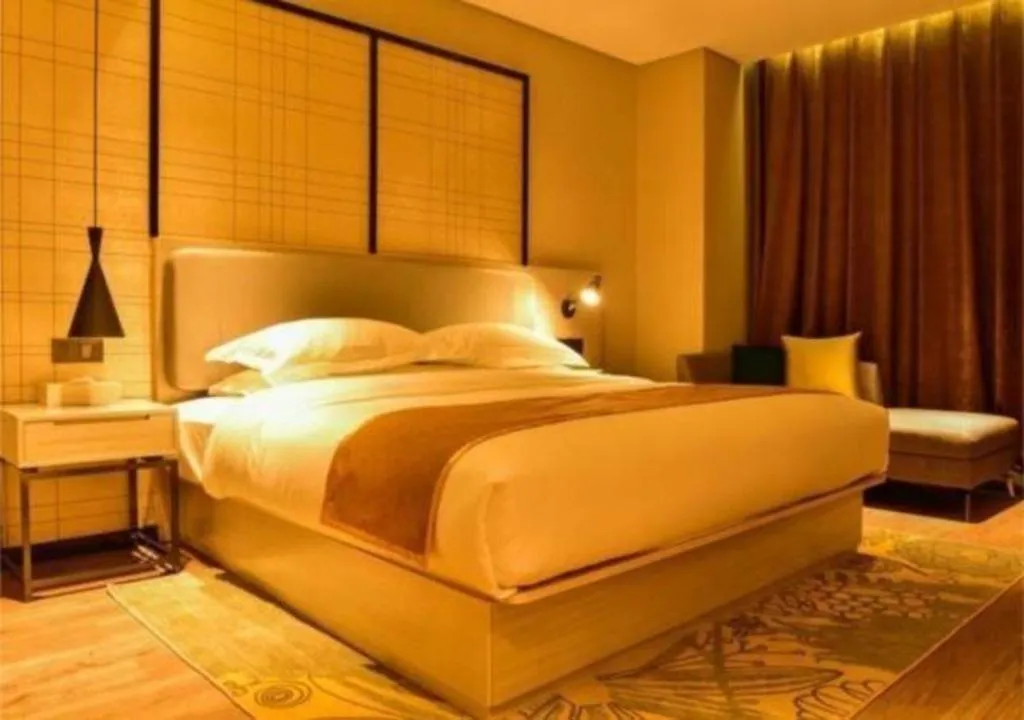 Bed in Echarm Hotel Xiantao Yuantai Weilaicheng