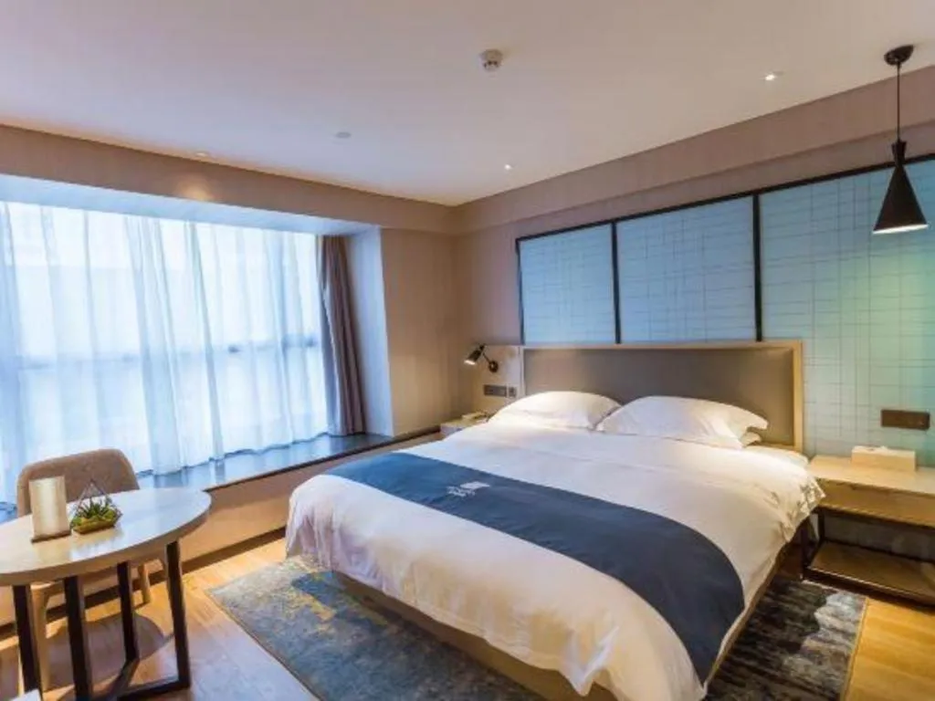 Bed in Echarm Hotel Xiantao Yuantai Weilaicheng