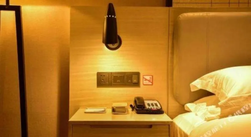 Bed in Echarm Hotel Xiantao Yuantai Weilaicheng