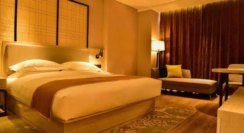 Bed in Echarm Hotel Xiantao Yuantai Weilaicheng