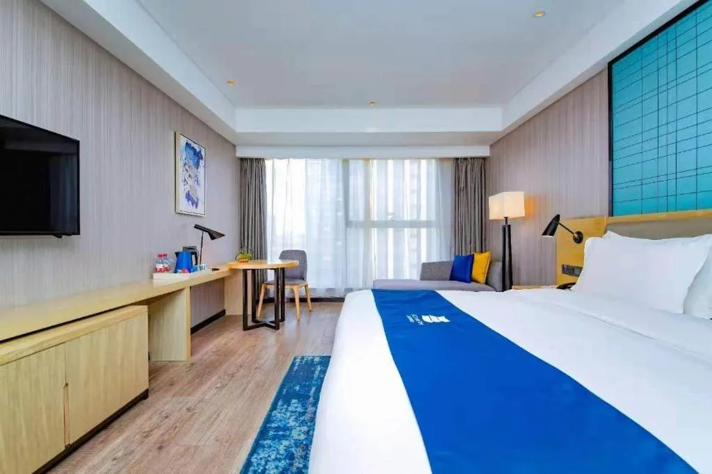 Bed in Echarm Hotel Xiantao Yuantai Weilaicheng