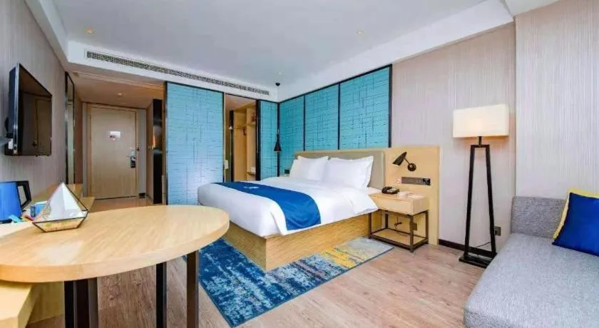 Bed in Echarm Hotel Xiantao Yuantai Weilaicheng