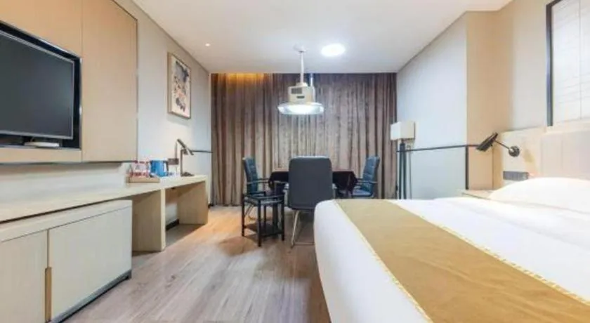 Bed in Echarm Hotel Xiantao Yuantai Weilaicheng