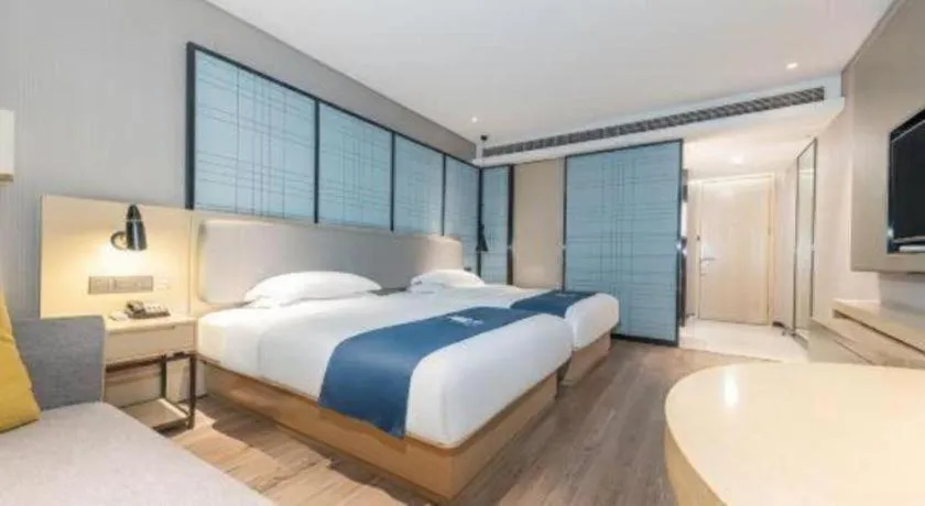 Bed in Echarm Hotel Xiantao Yuantai Weilaicheng