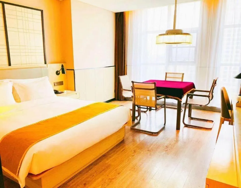 Bed in Echarm Hotel Xiantao Yuantai Weilaicheng