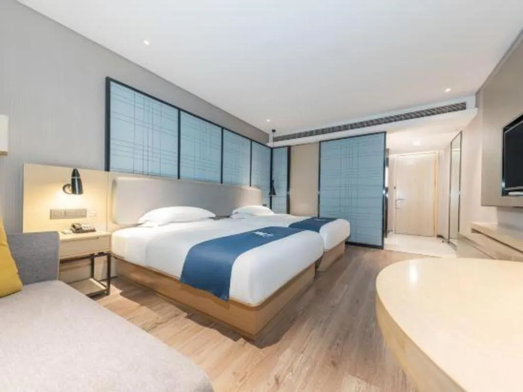 Bed in Echarm Hotel Xiantao Yuantai Weilaicheng