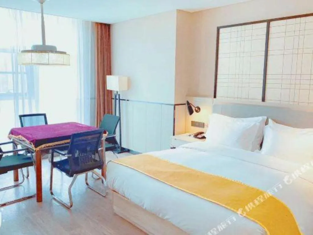 Bed in Echarm Hotel Xiantao Yuantai Weilaicheng