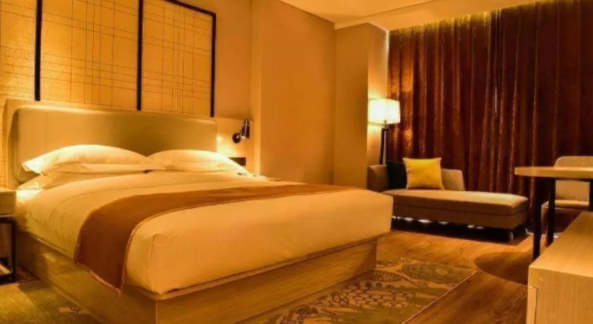 Bed in Echarm Hotel Xiantao Yuantai Weilaicheng